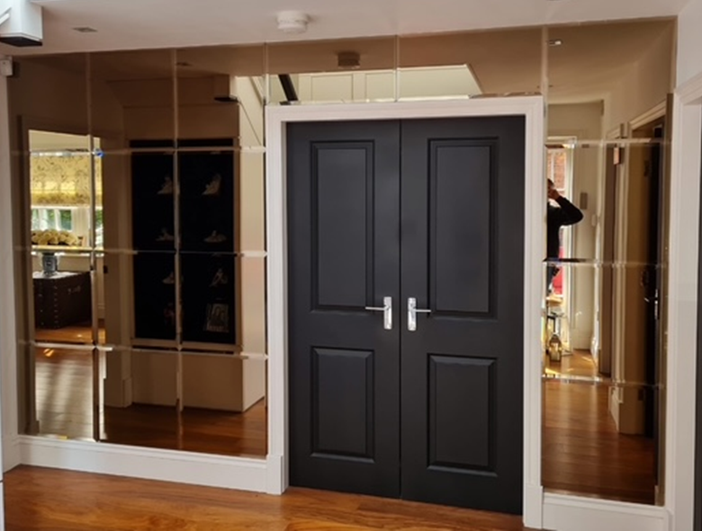 Luxury mirror wall installation around doors
