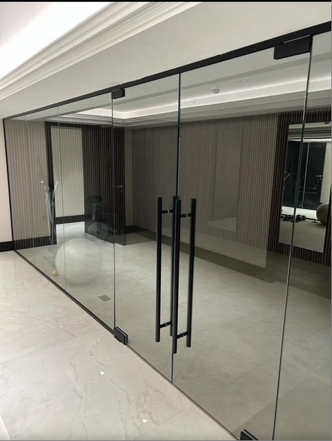 Large glass partition with black frames