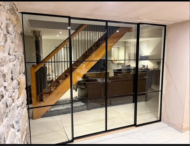 Glass partition with staircase view