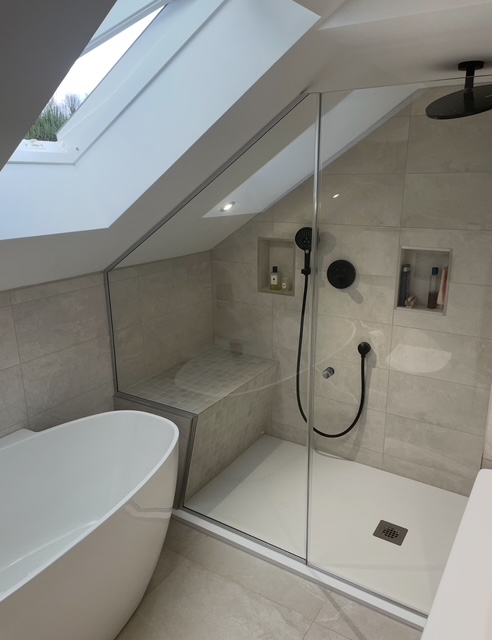 Loft bathroom with skylight shower